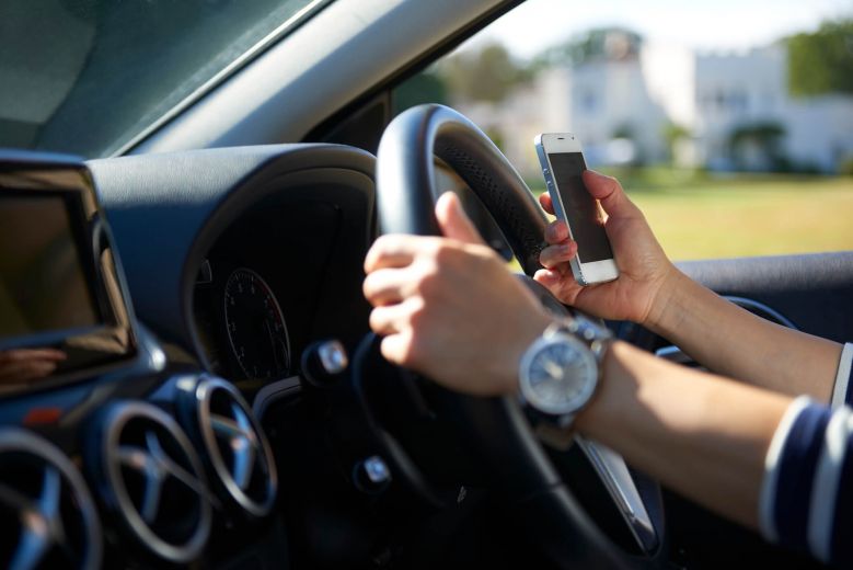 The RAC implores police forces to 'turn up the dial' on drivers' handheld mobile phone use