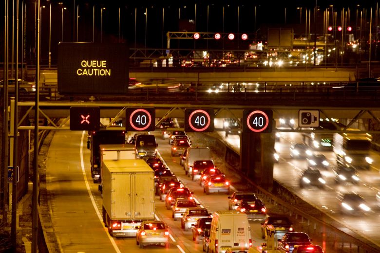 How much time do drivers waste on road delays every year?